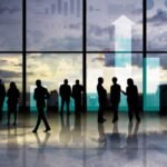 Property Investors standing near building glass discussing smsf growth