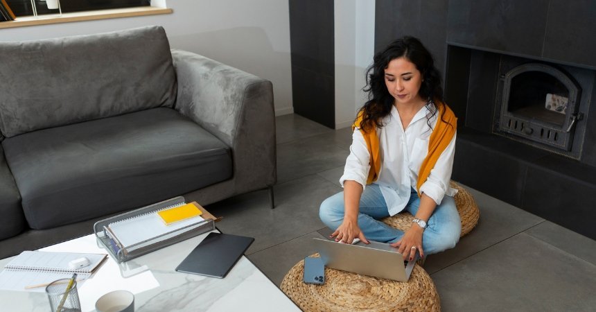 Woman researching property opportunities for investment in NSW from home on a laptop